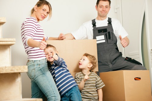 Removal staff using PPE during a moving day in Twickenham